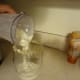 Carefully pour the milkshake into the glass without touching the rimming.