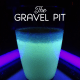 The drink glows a green color with thick, chunky bits at the top.