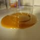 Gently dip the glass into the caramel.