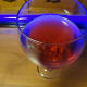 The drink will look purple in normal light.