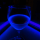 The drink glows a bright blue because of the tonic water.