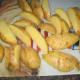 Cut potatoes into wedges.