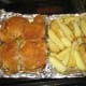 After 25 minutes, turn chicken and stir potatoes.