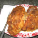 Drain cooked chicken.