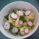 Iceberg lettuce, radish greens, and sliced radish salad.