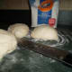 Divide the dough evenly, making four smaller balls; let it rest for five minutes.