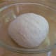 Put the dough in a greased bowl.