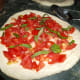 Put some basil on top of the tomatoes.