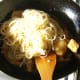 Noodles are added to wok