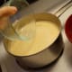 When the mixture boils, scoop out about a cup of the rice mixture.