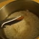 Add cut-up pieces of cinnamon stick to the rice. Heat the rice to boiling before simmering for about 15 minutes.
