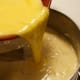 While the rice mixture is still on medium-low heat, SLOWLY add the egg mixture and stir constantly. This will help ensure that the egg mixture doesn't clot.