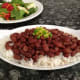 Serve over hot white rice and garnish with diced peppers.