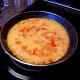 Add rice and garlic powder. Stir well.