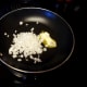 Heat onions and butter in skillet until tender.