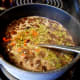 Reduce heat and add parsley, red pepper, and salt. Simmer for 5-10 minutes and serve.
