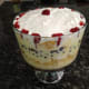 10. Add strawberry slices around the rim and place one slice in center of trifle.