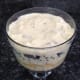 7. Add a layer of cubed cake, sprinkle with Amaretto, and follow with a final layer of pudding.