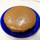 Step 4: Pour on the first layer of the cake and it will spread over the sides. Add second layer and pour the rest. Use a knife to spread a little on sides. As the icing cools, it will set.