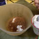 Step 4: Add 1/2 cup unsweetened cocoa, 1/2 cup sour cream (or yogurt, or milk), and 1/2 cup boiling water (put in microwave for 1 minute).