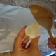 Butter the spoon to keep the treats from sticking.