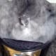 Be careful not to let the steam burn as the level of water collecting in the filter is checked.