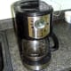 Turn the coffee maker on and let it cycle, cleaning itself.