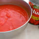 Mix tomato soup with crushed tomatoes and pour over the stuffed peppers and over the meat balls.