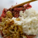 Mix sauteed onions and rice with ground beef.