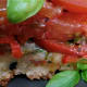A slice of tomato parmesan pie, with extra basil. Nom!