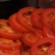 Sliced tomato layer in the casserole dish.