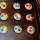Flatten dough and add extra M&M's to top of each cookie.