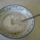 Add freshly ground buckwheat flour and water to the mashed banana and mix gently.