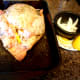 Stuff the onion slices and lemon wedges inside the cavity of the chicken.