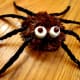 Add 2 marshmallows and dot with icing to create the eyes of the spider.