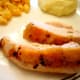 Lemon and herb roast chicken served with mashed potatoes and macaroni and cheese.