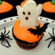 Add a ghost marshmallow and bat ring to finish the cupcake design.