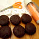 Cut off 1/3 of the ghost bottom and frost the cupcakes with orange icing.