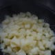 Drain the boiled potatoes then put them back into the pan you cooked them in to start adding butter, milk and mashing them.