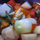 Preparing vegetables for roasting.