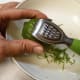 Zest Lime using microplaner by pulling down.