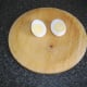 Cooled duck egg is carefully halved