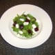Beetroot and feta cheese are added to bed of green salad leaves