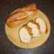 Bread is sliced for making bruschetta