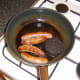 Sausages and black pudding are fried first