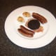 Meat components are added to the plate alongside the deviled duck eggs