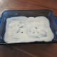 Layer #1: Alfredo sauce in the bottom of the pan.