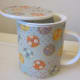 Place loose tea or tea bag into strainer.
