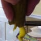 This can get a bit messy but you will end up with a dill pickle curl.