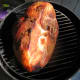 Cook the ham on a smoker.